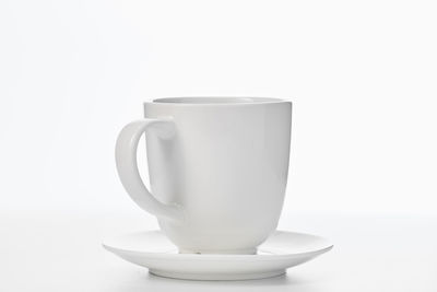 Close-up of coffee cup against white background