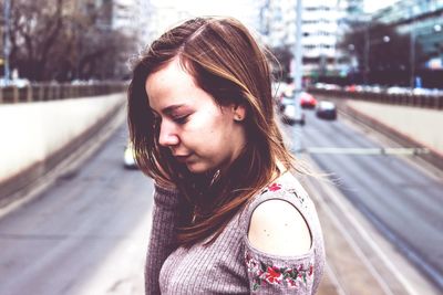 Portrait of woman smiling in city