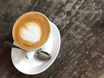 High angle view of cappuccino on table