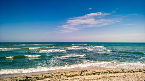 Scenic view of beach against sky