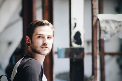 Portrait of young man standing outdoors