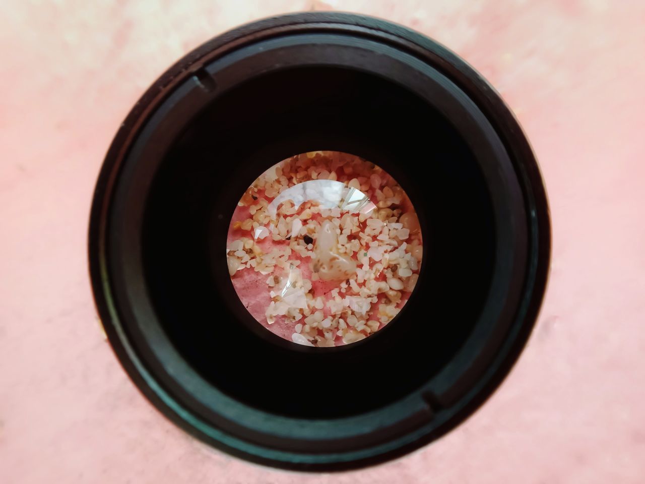 HIGH ANGLE VIEW OF DRINK ON GLASS TABLE