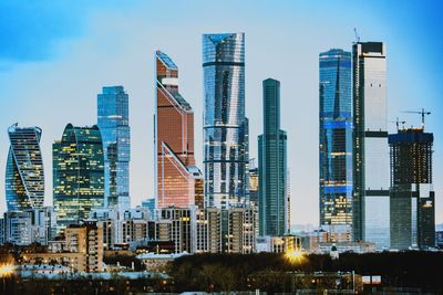 Modern buildings in city against sky