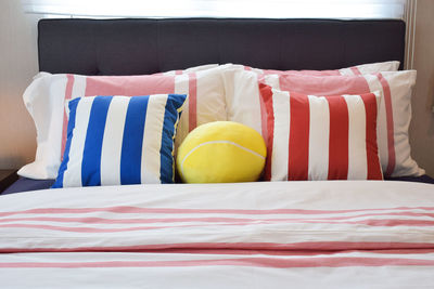 Multi colored balls on bed at home