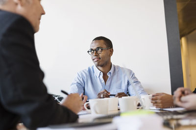 Businessman looking away during meeting in office