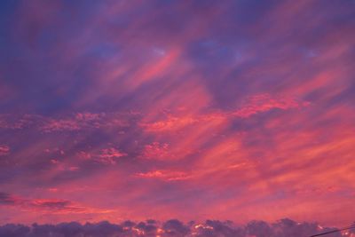 Low angle view of dramatic sky during sunset