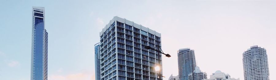 Low angle view of modern buildings against clear sky