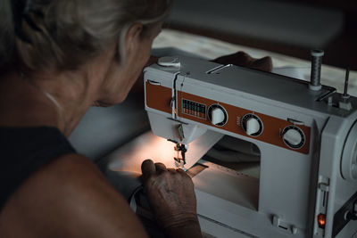 Woman using sewing machine