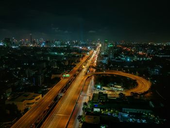 High angle view of illuminated city at night