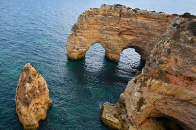 High angle view of rock formation in sea