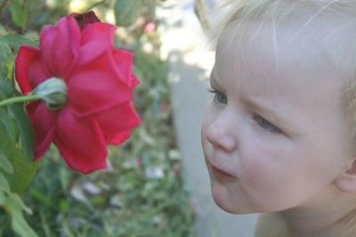 Close-up of cute boy with flowers