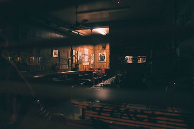 Empty chairs in illuminated room