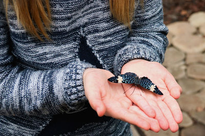 Close-up of woman holding hands