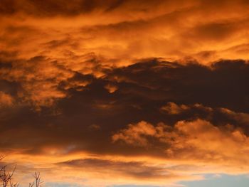 Low angle view of cloudy sky at sunset