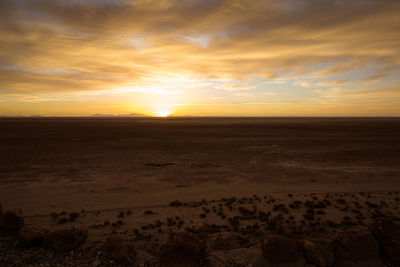 Scenic view of sunset at salar de uyuni against sky