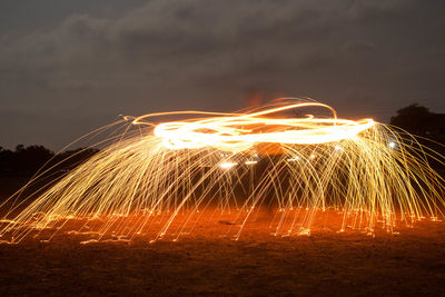 Light painting against sky at night