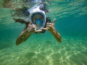 Portrait of woman swimming in sea