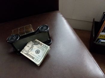 High angle view of coins on table