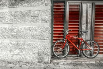 Bicycle leaning against wall