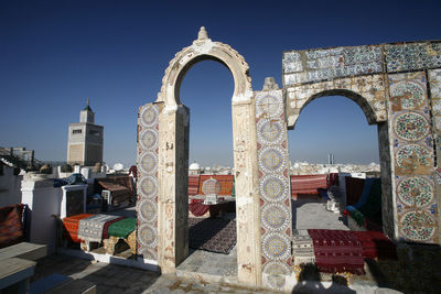 Buildings against clear blue sky