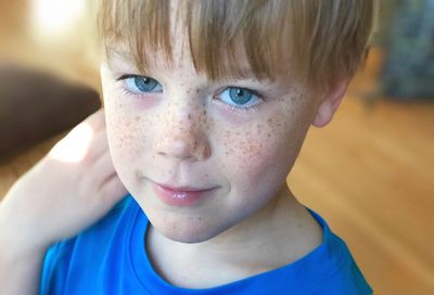 Close-up portrait of boy with blue eyes