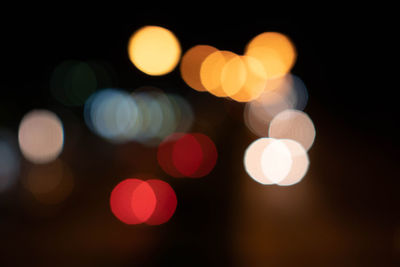 Defocused image of illuminated lights at night