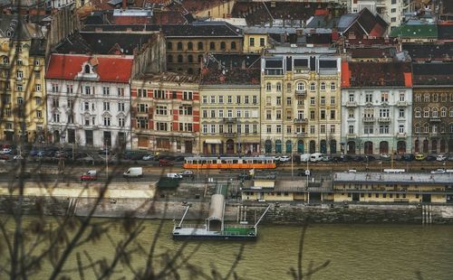 Old buildings in city by river