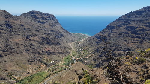 High angle view of rocky mountains against sky