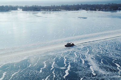 High angle view of snow on shore