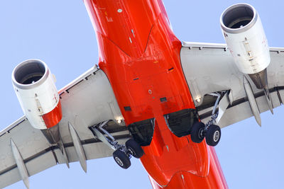 Low angle view of airplane against clear sky