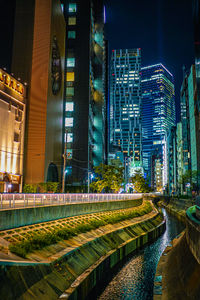 Illuminated buildings in city at night