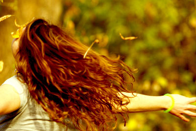 Close-up of woman against blurred background