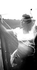 Midsection of man sitting against sky