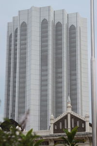 Low angle view of modern buildings against sky