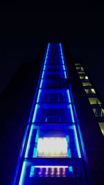 Low angle view of illuminated modern building at night