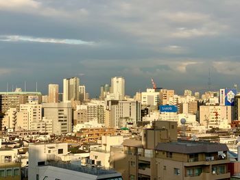 High angle view of buildings in city against sky