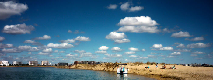 Panoramic view of people on beach