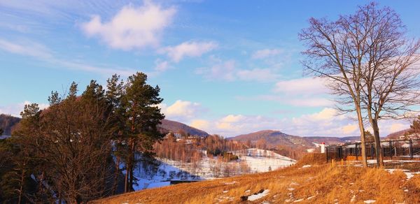 Scenic view of landscape against sky during winter