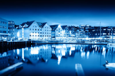 Reflection of illuminated buildings in water at night