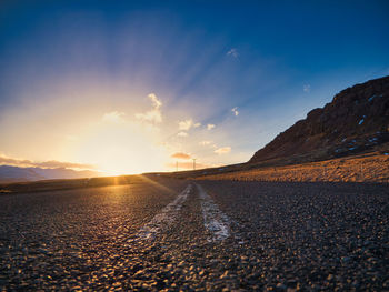 Scenic view of road against sky during sunset