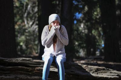 Portrait of young woman in forest