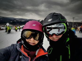 Portrait of couple in ski-wear