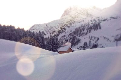 Scenic view of snow covered mountains