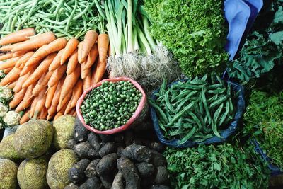 Fresh vegetables at the market. carrots, peas, leek, salad, okra, lady fingers, beetroot, yak fruits