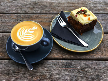 High angle view of coffee and cup on table