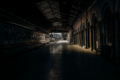 Empty alley amidst buildings in city