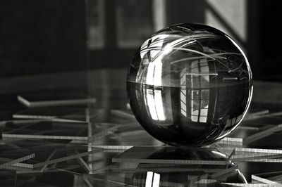 Close-up of crystal ball on table