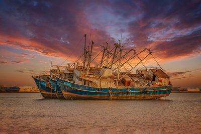 Boats moored at harbor