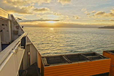 Scenic view of sea against sky during sunset seen from ship