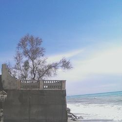 Scenic view of sea against blue sky